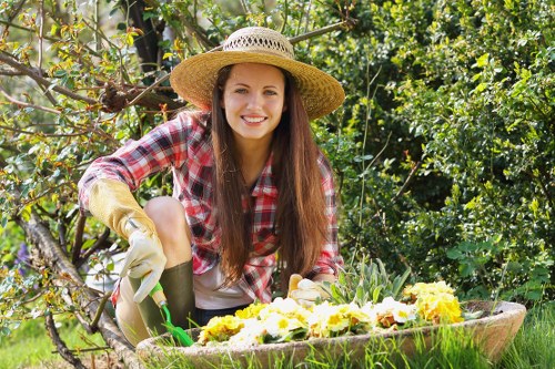 Gardeners wearing PPE and following safety protocols on a landscaping site