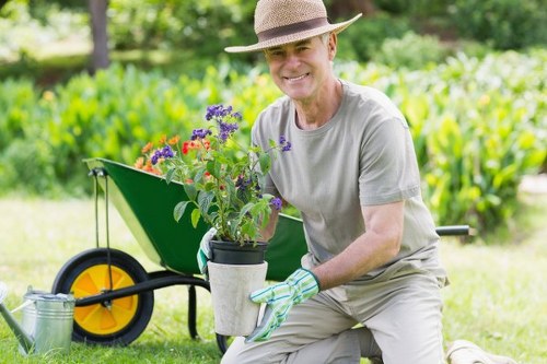 Compliant and insured gardening team setting up for a landscaping job